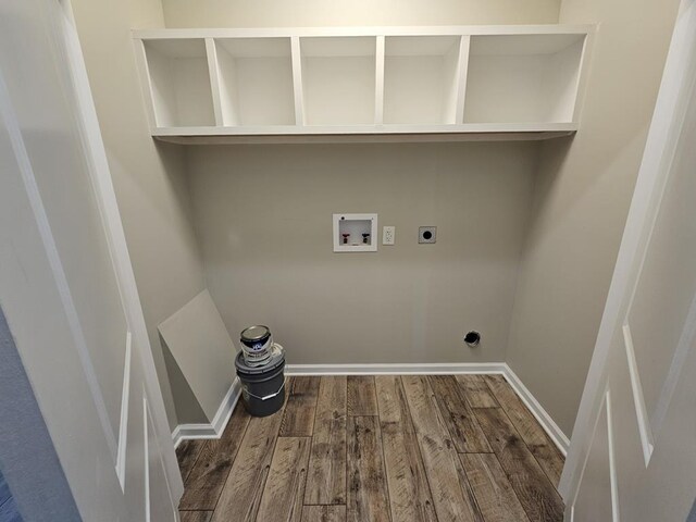 laundry area featuring hookup for a washing machine, laundry area, wood finished floors, baseboards, and electric dryer hookup