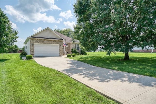 ranch-style home with an attached garage, brick siding, concrete driveway, and a front yard