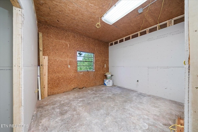 spare room featuring unfinished concrete floors