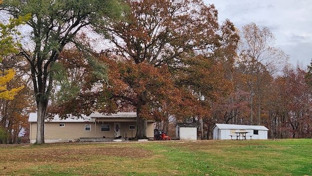 exterior space featuring a storage unit and an outbuilding