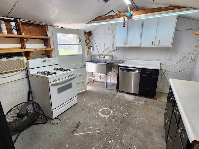 kitchen with white gas range, light countertops, stainless steel dishwasher, white cabinetry, and a sink