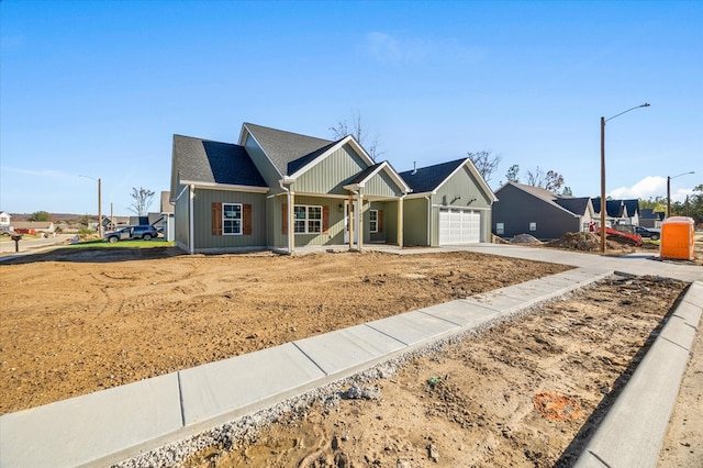 view of front of property with a garage, concrete driveway, and board and batten siding