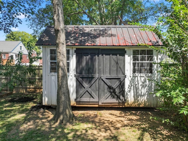 view of shed with fence