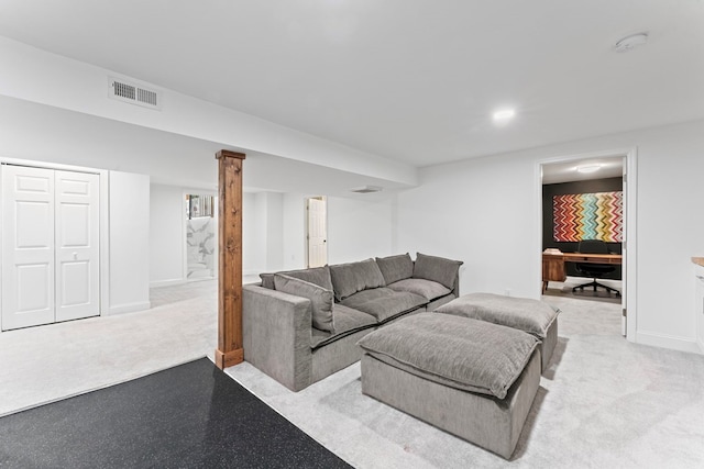 living area with light carpet, visible vents, and baseboards