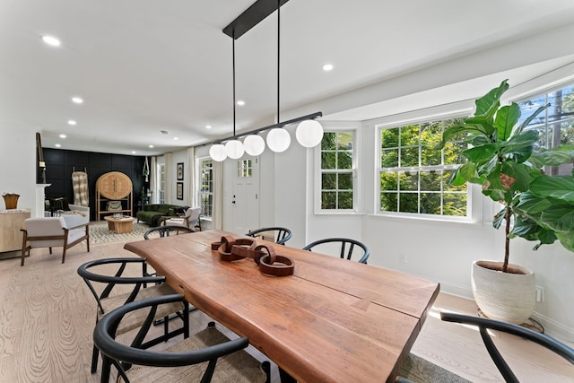 dining space featuring baseboards and recessed lighting