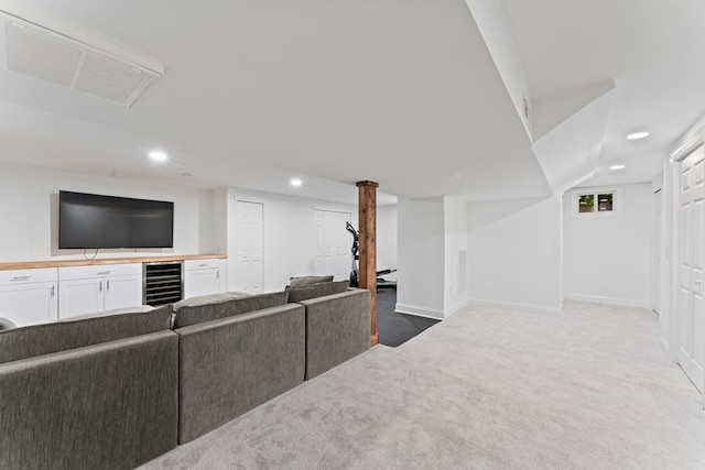 living area featuring recessed lighting, beverage cooler, carpet floors, visible vents, and baseboards