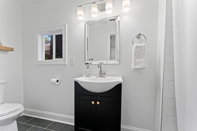 full bath with toilet, vanity, baseboards, a shower stall, and tile patterned floors