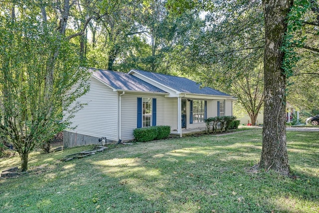 ranch-style home with a porch and a front yard