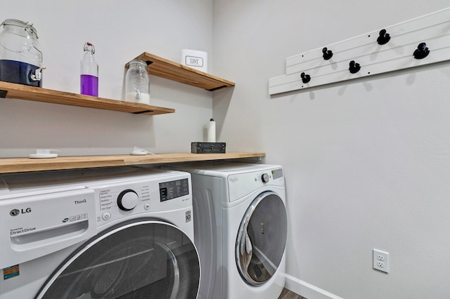 washroom featuring laundry area and washing machine and clothes dryer