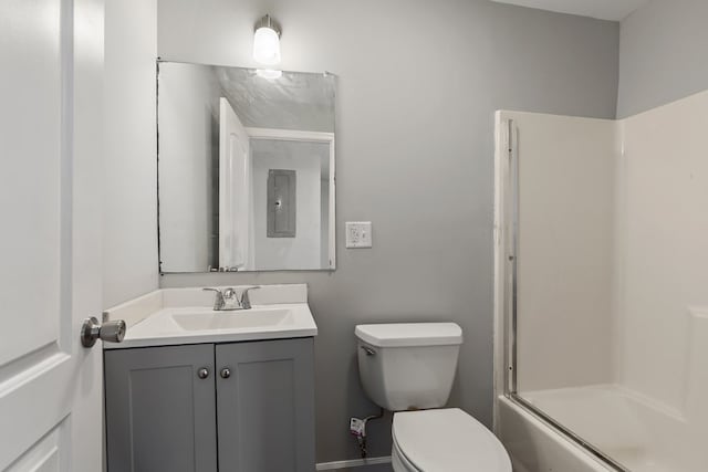 bathroom featuring electric panel, combined bath / shower with glass door, toilet, and vanity