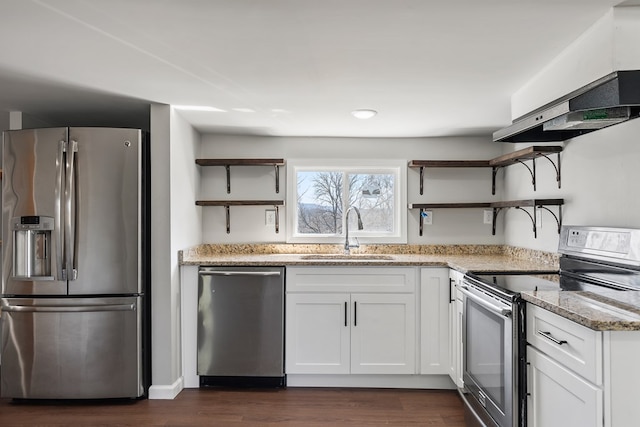 kitchen with under cabinet range hood, a sink, appliances with stainless steel finishes, and open shelves