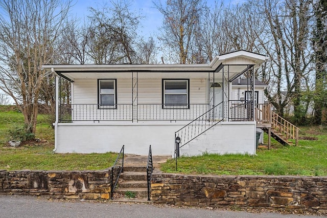 view of front facade featuring stairs and a porch