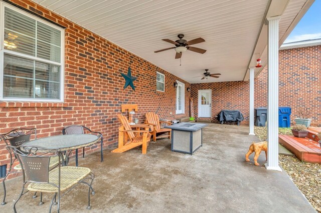 view of patio / terrace featuring ceiling fan, a fire pit, and area for grilling