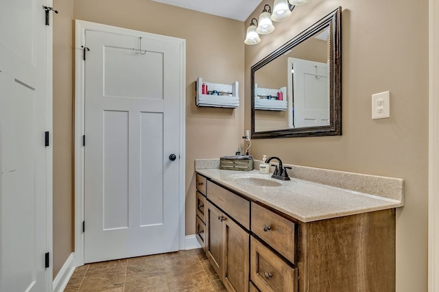 bathroom featuring vanity and baseboards