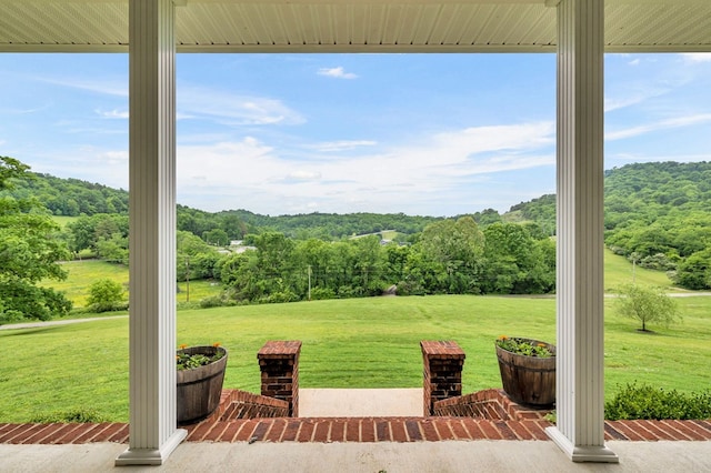 view of patio featuring a wooded view