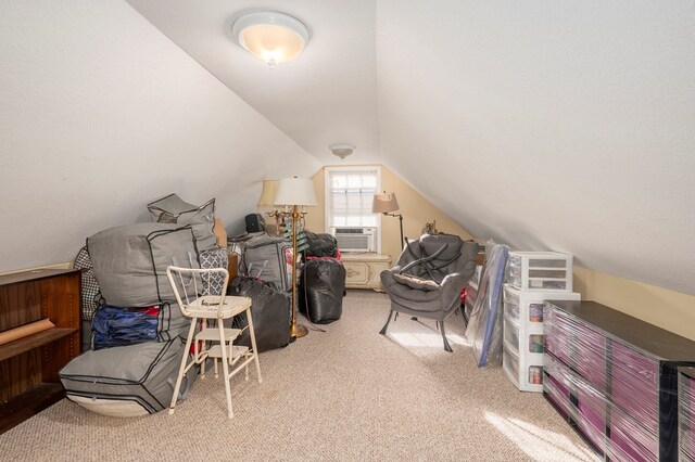 additional living space featuring light carpet, cooling unit, and lofted ceiling