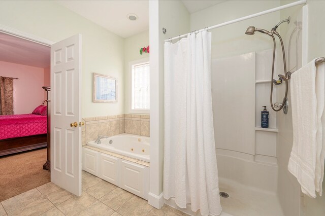 full bath with a shower stall, ensuite bath, a whirlpool tub, and tile patterned floors