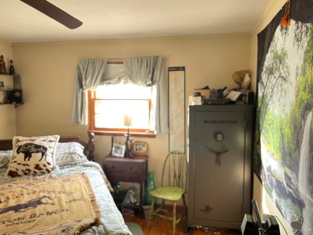 bedroom with a ceiling fan and dark wood-type flooring