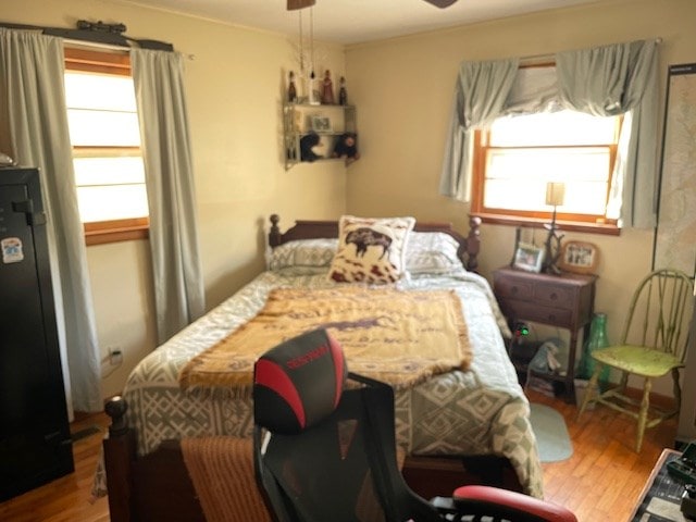 bedroom with ceiling fan and wood finished floors