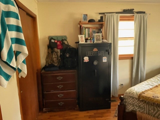 bedroom with wood finished floors