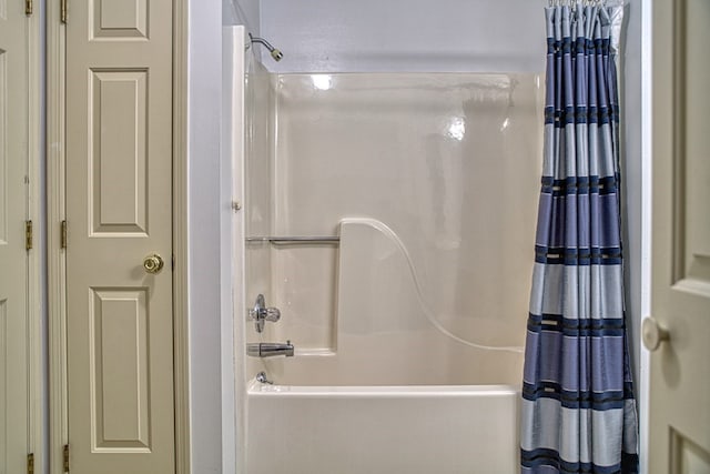 bathroom featuring shower / bathtub combination with curtain