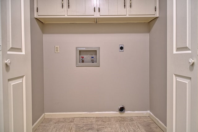 laundry area with baseboards, washer hookup, cabinet space, and hookup for an electric dryer