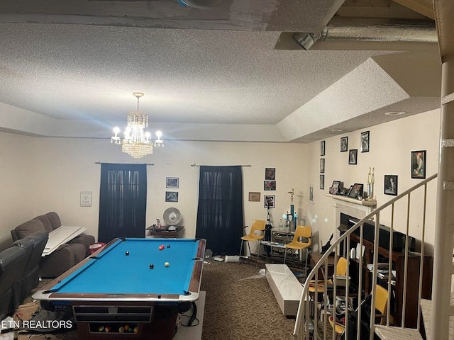 playroom featuring carpet, billiards, a chandelier, and a textured ceiling