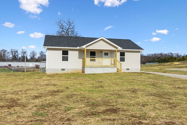 view of front of property with a shingled roof, crawl space, covered porch, and a front lawn