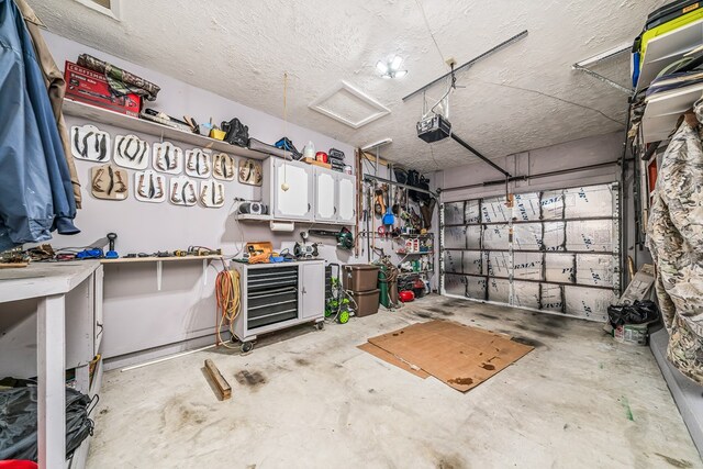 garage featuring a workshop area and a garage door opener