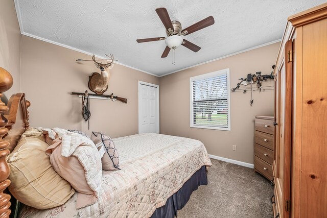 bedroom with carpet, a textured ceiling, ornamental molding, and a closet