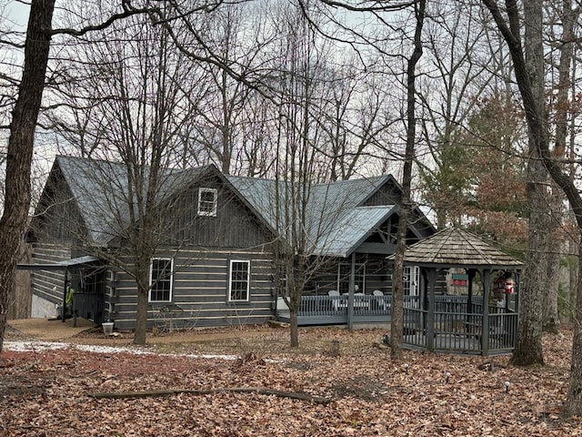 log-style house with a gazebo