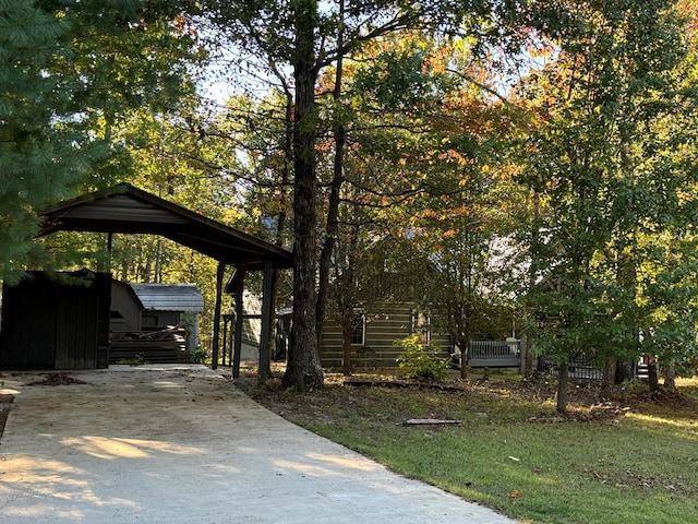 exterior space featuring driveway and a detached carport