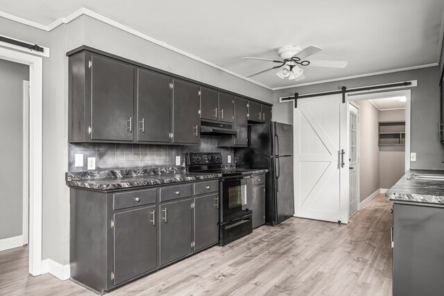 kitchen with a barn door, under cabinet range hood, a ceiling fan, black appliances, and dark countertops