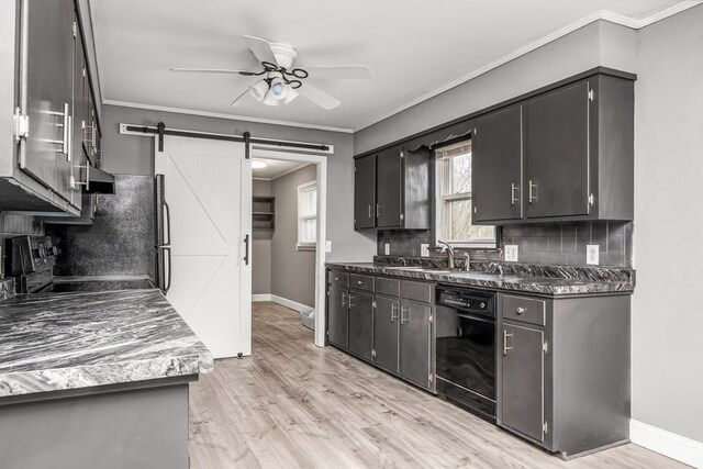 kitchen with ceiling fan, a barn door, black dishwasher, dark countertops, and crown molding