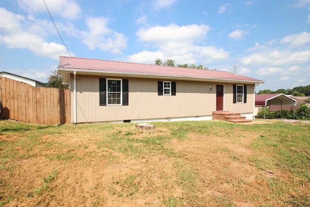 single story home with crawl space, metal roof, fence, and a front lawn