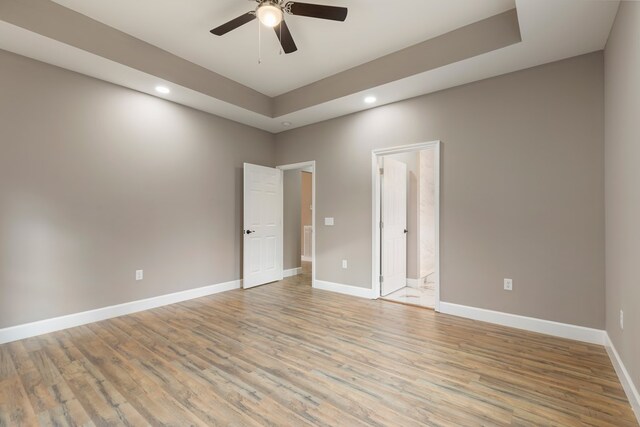 unfurnished room featuring light wood-style floors, recessed lighting, a ceiling fan, and baseboards