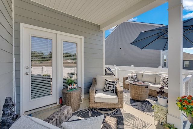 view of patio / terrace featuring an outdoor living space with a fire pit