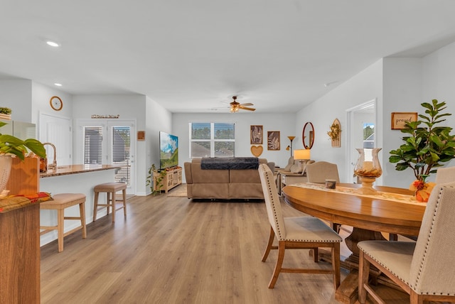 dining area with a ceiling fan, recessed lighting, baseboards, and light wood finished floors