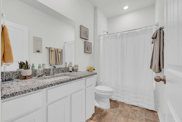 full bath with a shower with shower curtain, toilet, stone finish flooring, vanity, and recessed lighting