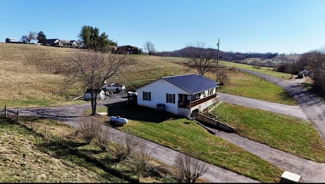 birds eye view of property with a rural view