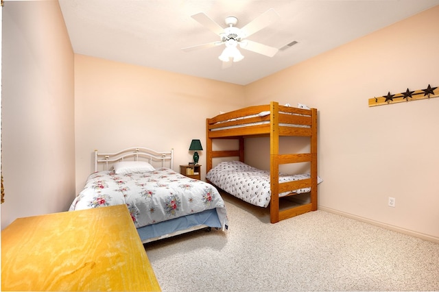 bedroom with ceiling fan, carpet, and baseboards