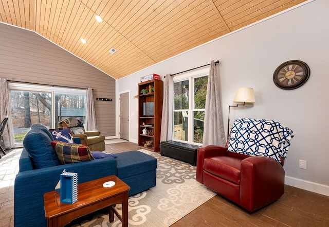 living room with lofted ceiling, wood ceiling, baseboards, and wood finished floors