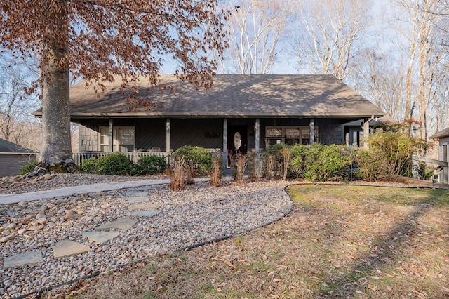 view of front of property featuring roof with shingles