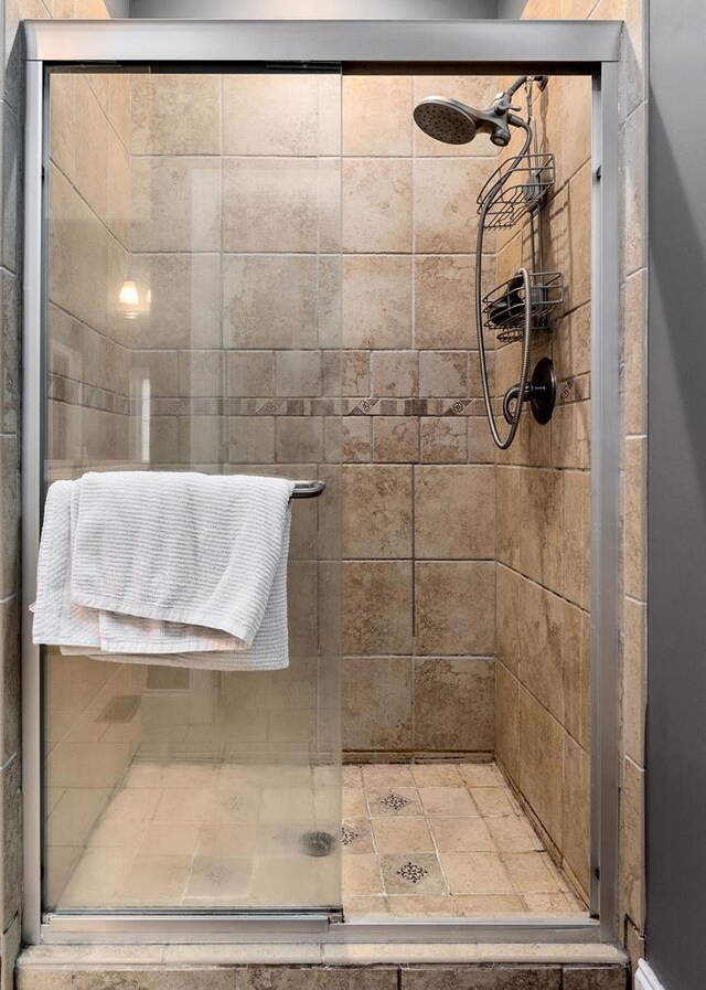 full bath featuring a shower stall