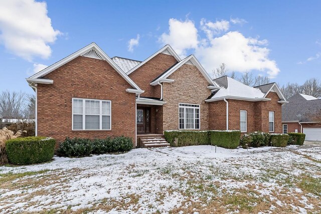 traditional-style home featuring brick siding