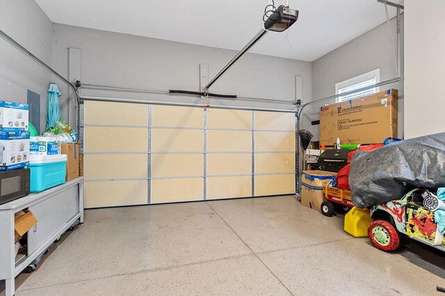 garage featuring a garage door opener