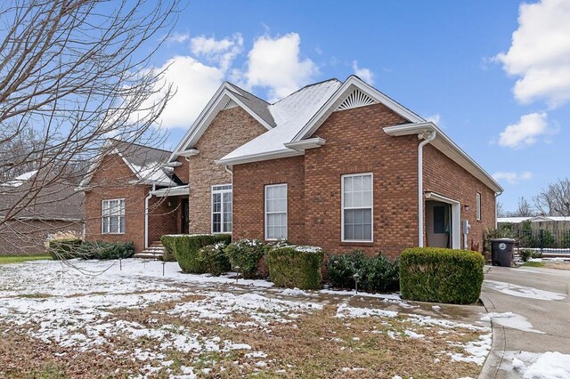 view of front of property featuring brick siding