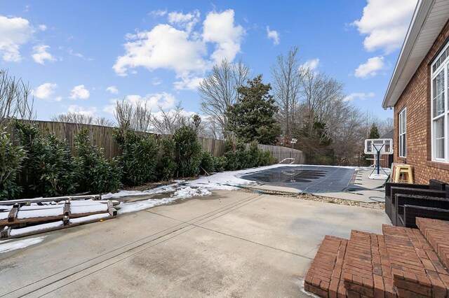 exterior space featuring a fenced backyard and a fenced in pool