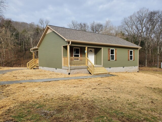 view of front of home featuring a porch, crawl space, and a shingled roof