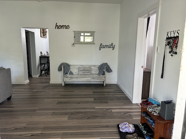 sitting room with dark wood-style floors and baseboards